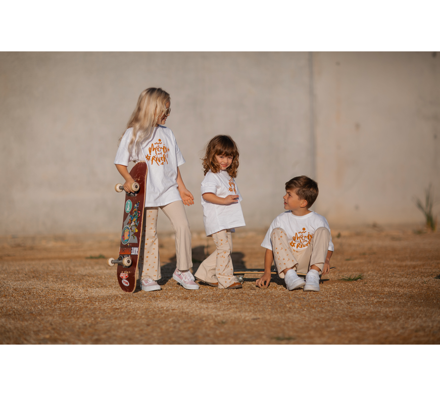 Two girls and a boy wearing Sun Dance Flares and Tee
