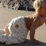 Baby at beach wearing Sun Dance Track Pant