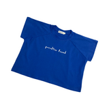 Blue T-shirt with the words 'Paradise Found' across the chest in white