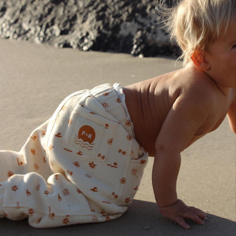 Baby at beach wearing Sun Dance Track Pant